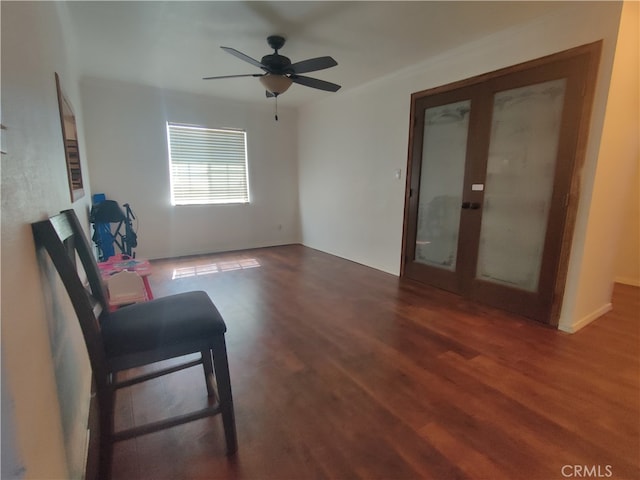 unfurnished room with dark hardwood / wood-style flooring, ceiling fan, and french doors