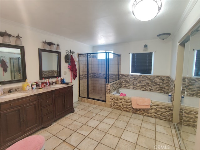 bathroom with crown molding, shower with separate bathtub, vanity, and tile patterned floors