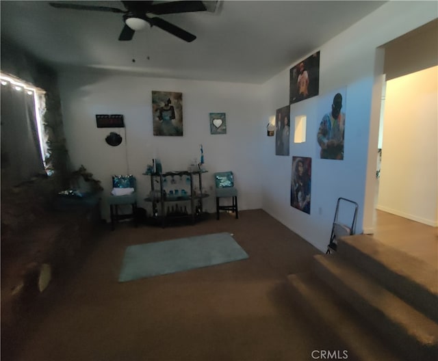 sitting room featuring carpet flooring and ceiling fan