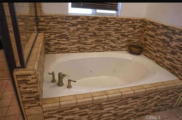 8043 Mojave Tropico Rd, Mojave, CA 93501 - bathroom featuring a tub with jets and tile patterned floors