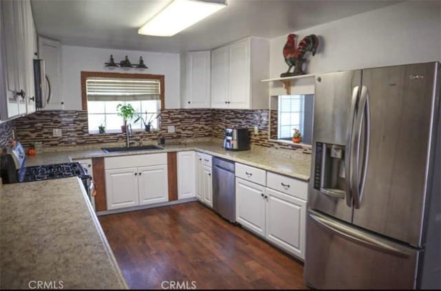 8043 Mojave Tropico Rd, Mojave, CA 93501 - kitchen with stainless steel appliances, white cabinets, and backsplash