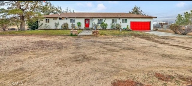 8043 Mojave Tropico Rd, Mojave, CA 93501 - ranch-style house featuring concrete driveway and an attached garage