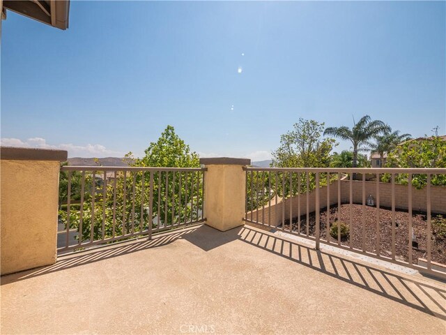 view of patio featuring a balcony