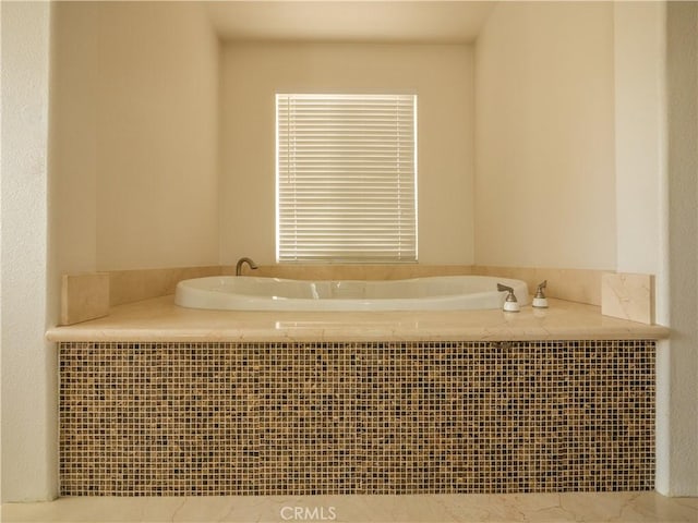 bathroom featuring tiled bath