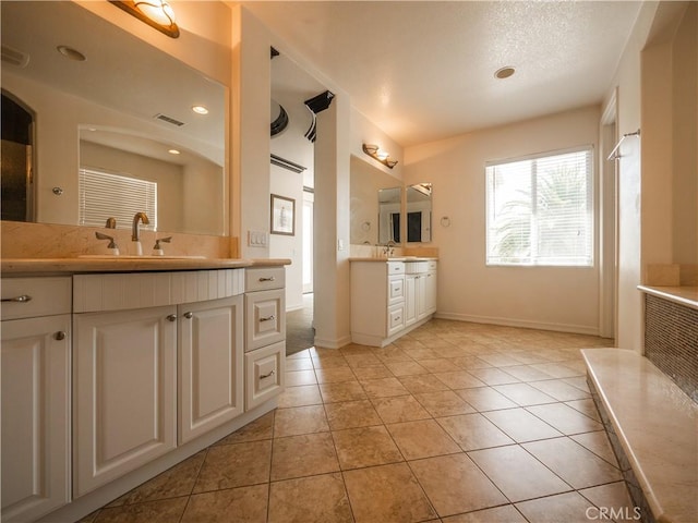 bathroom featuring tile patterned floors and vanity