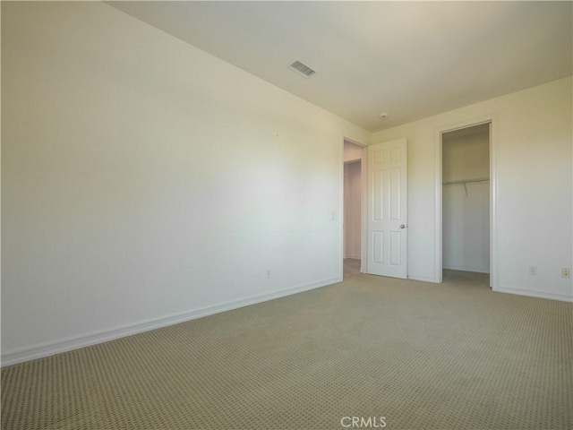 unfurnished bedroom featuring a closet and carpet floors