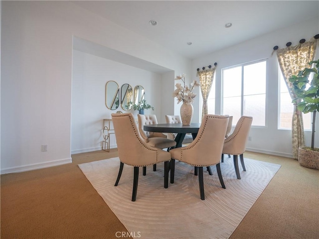 view of carpeted dining area