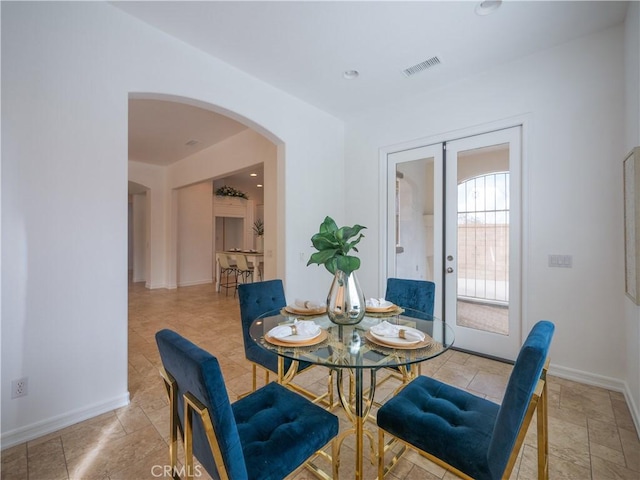 dining space featuring french doors