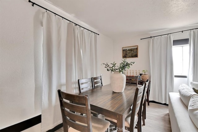 dining room featuring light hardwood / wood-style flooring