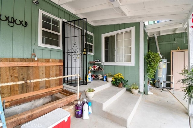 doorway to property featuring water heater