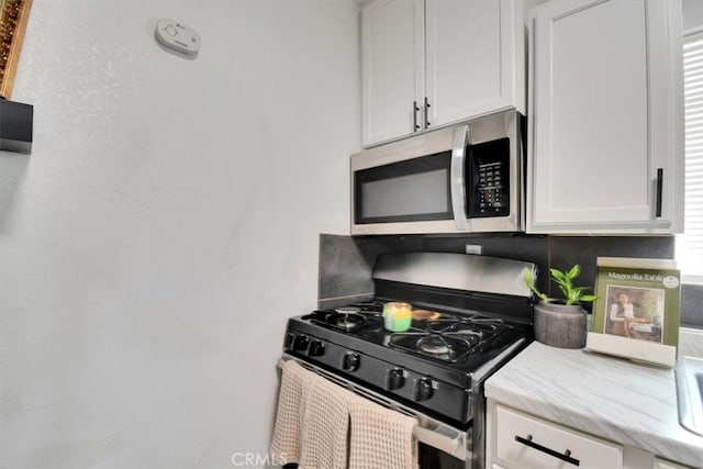 kitchen featuring white cabinets and stainless steel appliances