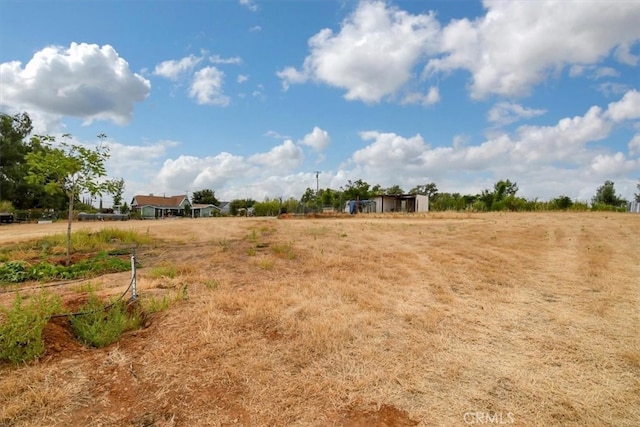 view of yard with a rural view