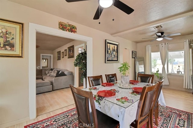 dining space featuring light hardwood / wood-style flooring and ceiling fan