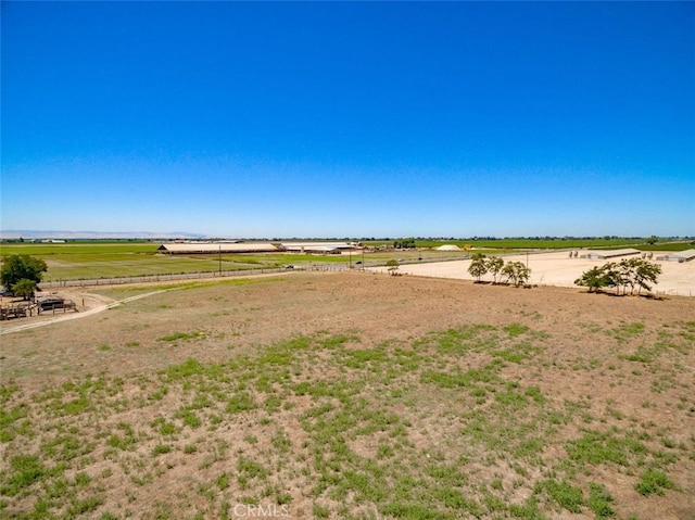 view of yard with a rural view