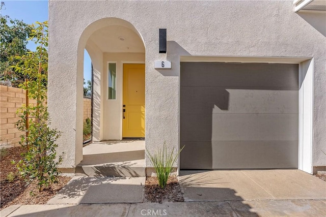 entrance to property featuring a garage