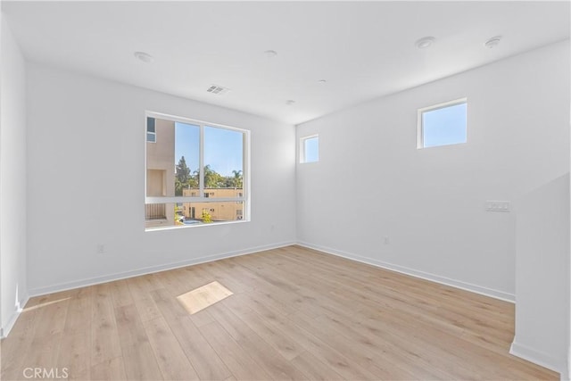 unfurnished room featuring light hardwood / wood-style flooring