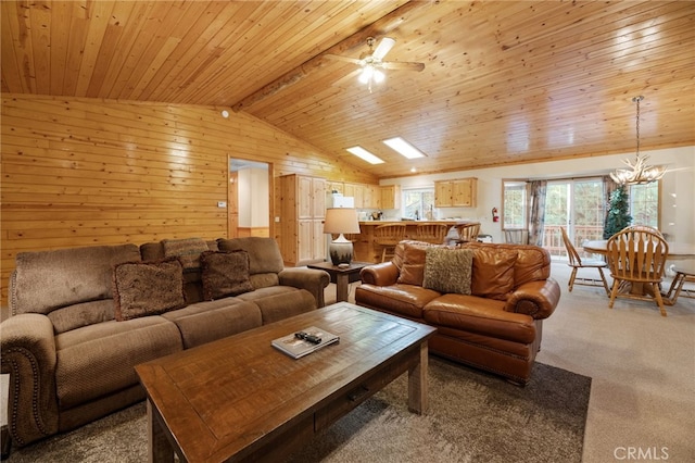 living room with wood walls, wooden ceiling, vaulted ceiling with beams, and carpet