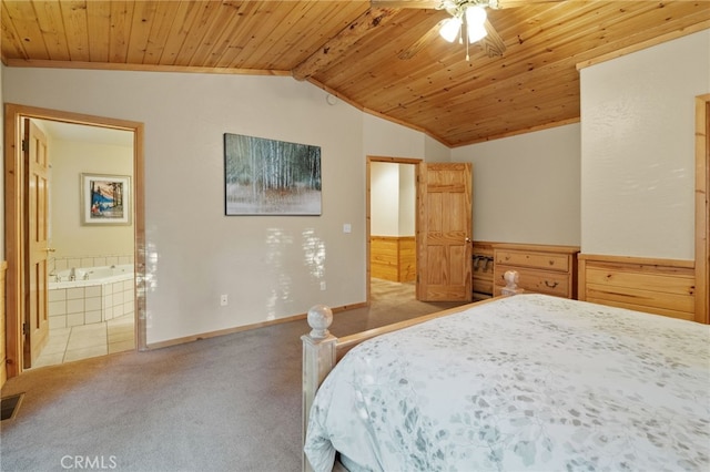 carpeted bedroom with lofted ceiling with beams, ensuite bathroom, ceiling fan, and wood ceiling