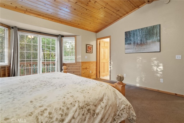 bedroom with lofted ceiling, wooden ceiling, carpet flooring, wood walls, and baseboards