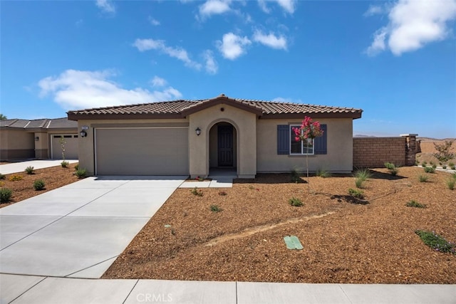 mediterranean / spanish-style home featuring a garage