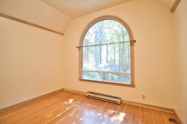 unfurnished room featuring wood-type flooring, lofted ceiling, and baseboard heating