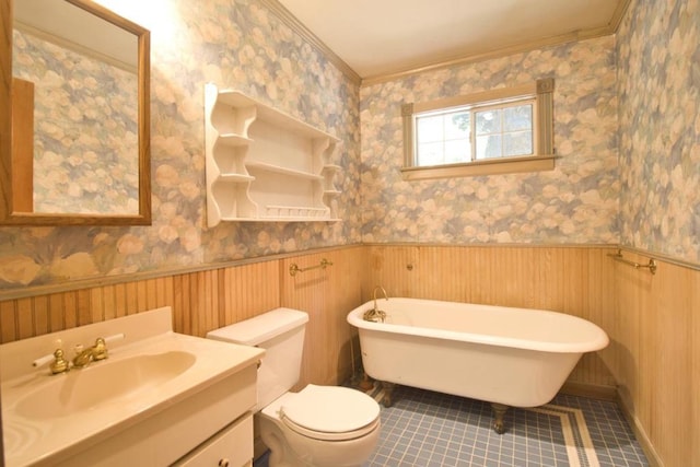 bathroom with tile patterned floors, a bathtub, toilet, and crown molding