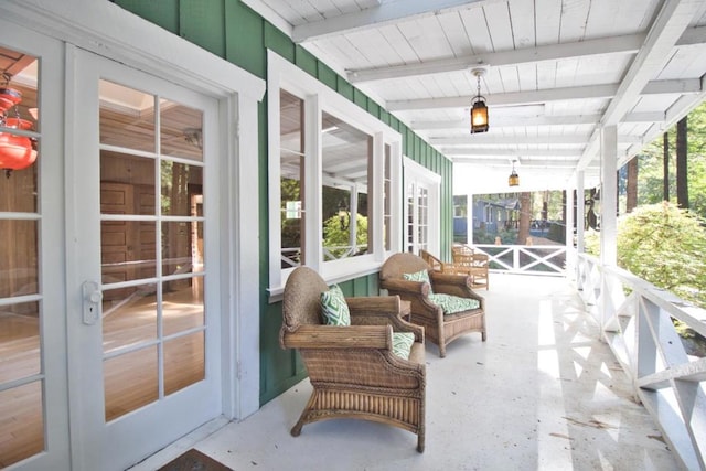 sunroom / solarium with beamed ceiling and wood ceiling