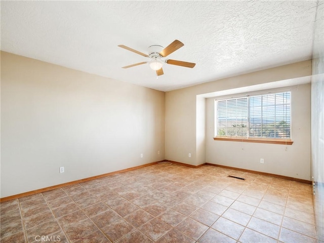 8187 Anaconda Ave, Oak Hills, CA 92344 - empty room with a textured ceiling, visible vents, baseboards, a ceiling fan, and tile patterned flooring