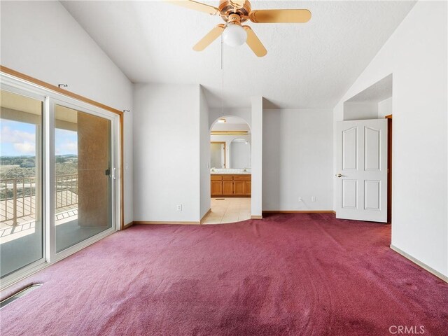 8187 Anaconda Ave, Oak Hills, CA 92344 - spare room featuring light carpet, baseboards, vaulted ceiling, and a ceiling fan