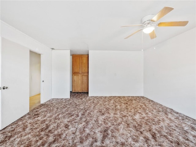 8187 Anaconda Ave, Oak Hills, CA 92344 - carpeted empty room featuring ceiling fan