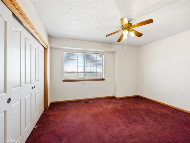8187 Anaconda Ave, Oak Hills, CA 92344 - unfurnished bedroom featuring a closet, carpet flooring, a textured ceiling, baseboards, and visible vents