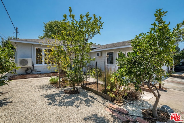 view of front of property with ac unit