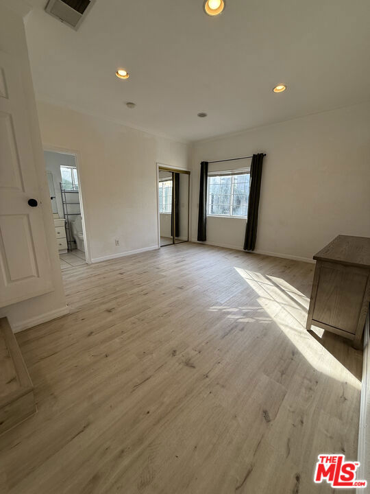 unfurnished room with light hardwood / wood-style flooring