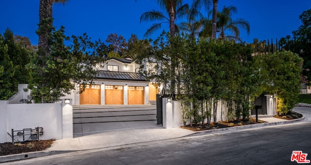 obstructed view of property featuring a garage