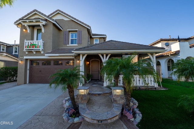 view of front facade with a front yard and a garage