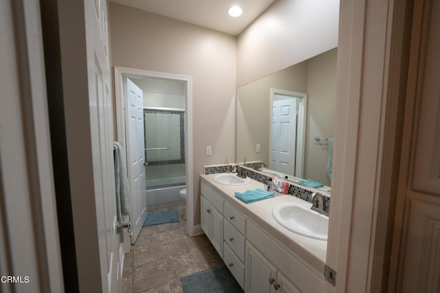 full bathroom with shower / tub combo, vanity, and toilet