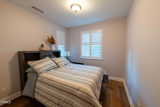 bedroom featuring dark hardwood / wood-style flooring