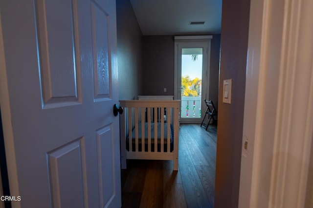 bedroom with dark wood-type flooring