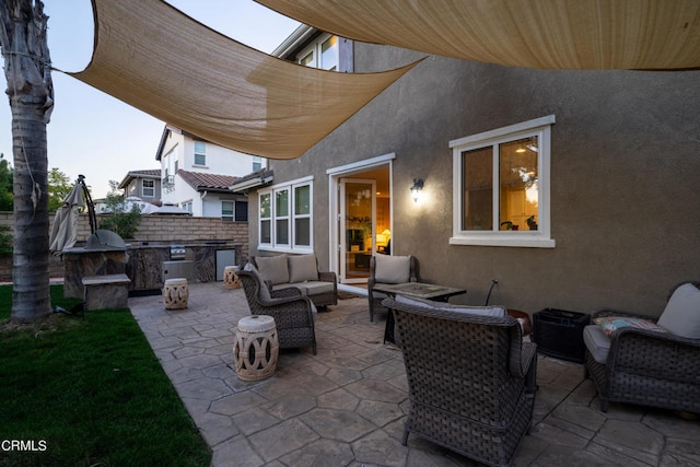 view of patio with exterior kitchen and outdoor lounge area