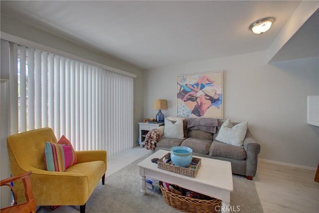 living room featuring plenty of natural light and light wood-type flooring