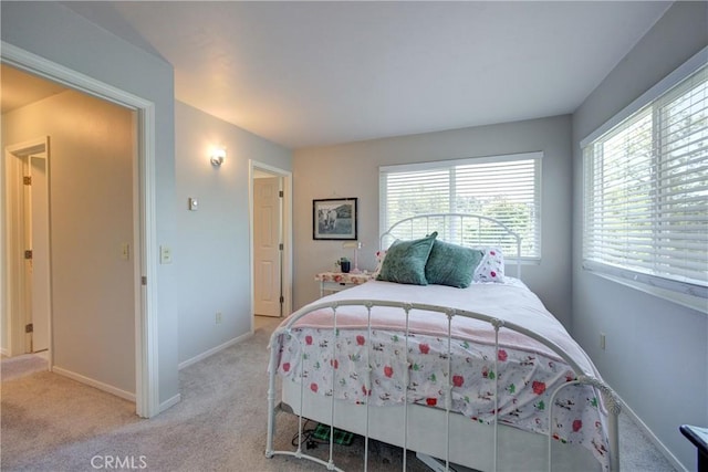 bedroom featuring light carpet