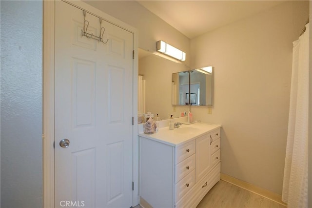 2650 Main St Unit 7, Cambria, CA 93428 - bathroom with wood finished floors, vanity, and baseboards