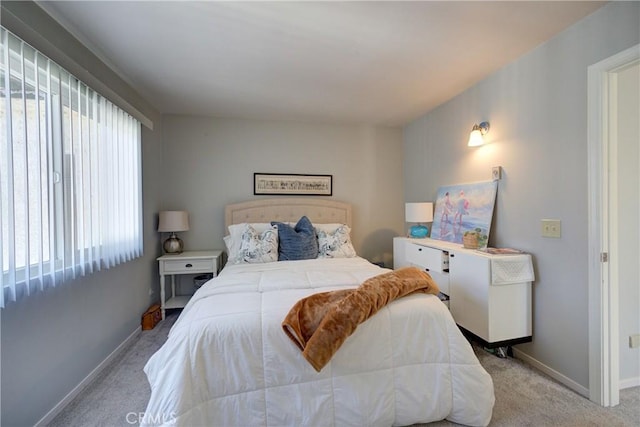 bedroom with light colored carpet