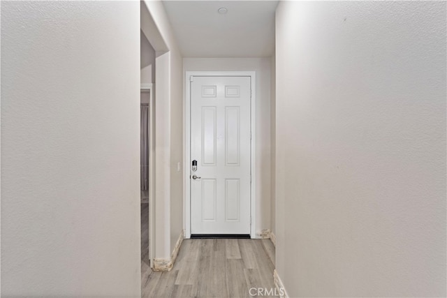 hallway featuring light hardwood / wood-style floors