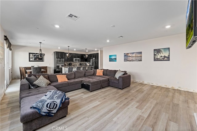 living room with light hardwood / wood-style floors