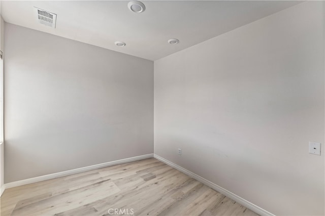 unfurnished room with light hardwood / wood-style floors