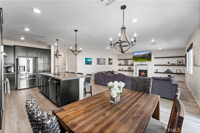 dining room featuring light hardwood / wood-style floors and sink