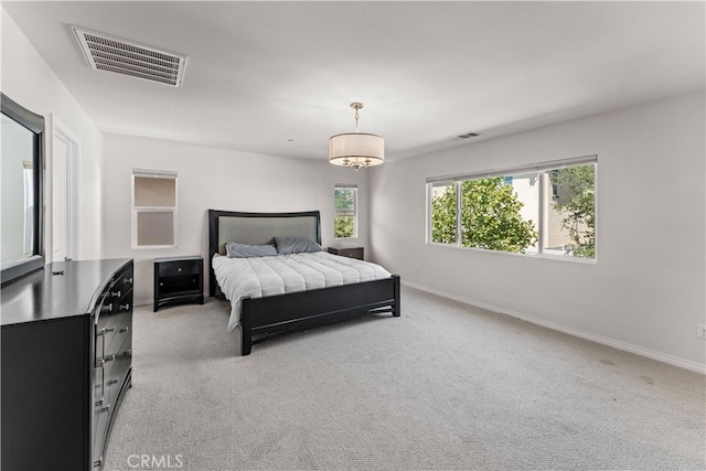 bedroom with light colored carpet