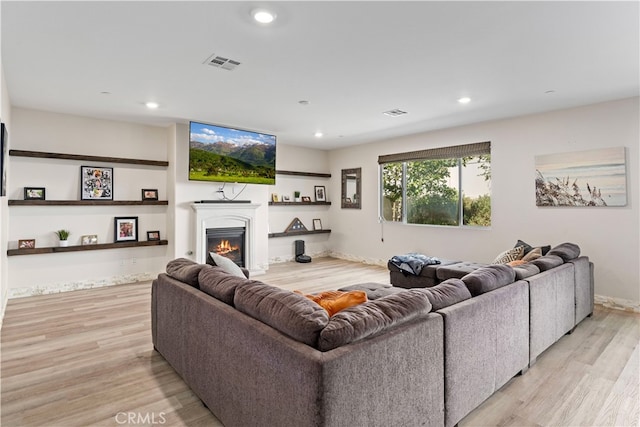 living room with light hardwood / wood-style flooring