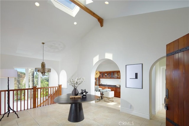 4347 Canyon View Ln, Palos Verdes Peninsula, CA 90274 - hallway featuring high vaulted ceiling, beam ceiling, arched walkways, a chandelier, and light tile patterned floors